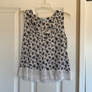 Maurices Black and white sleeveless blouse.